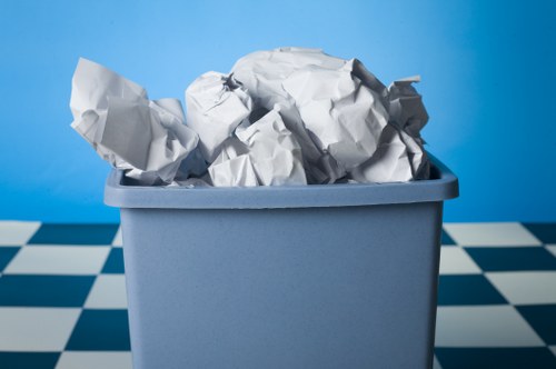 Clean office environment with organized waste disposal in Blackfriars